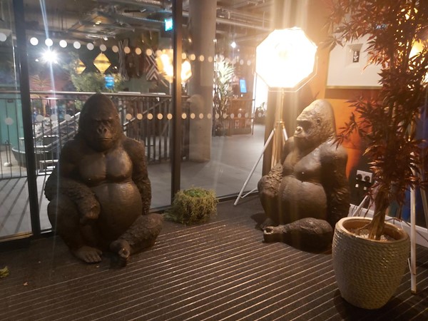 Image of statues of gorillas sitting outside a building